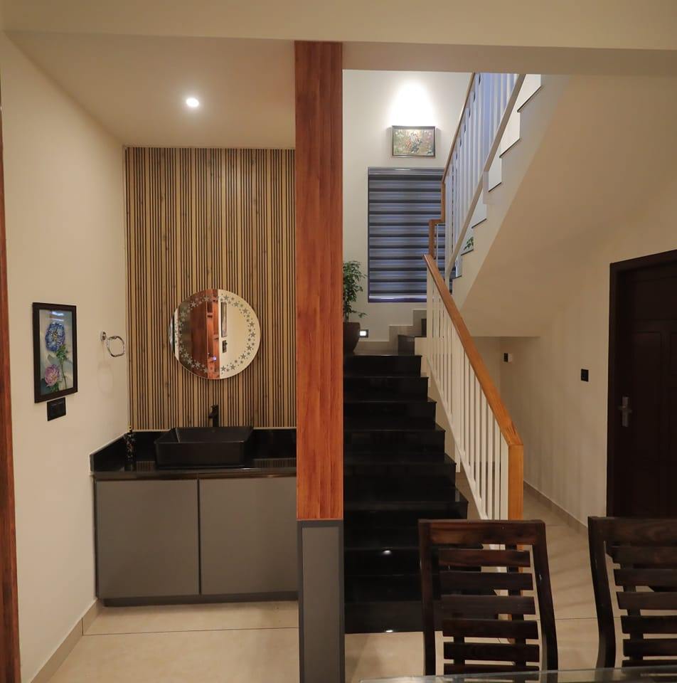 Stylish internal staircase with wooden handrails at Kattakada, Thiruvananthapuram